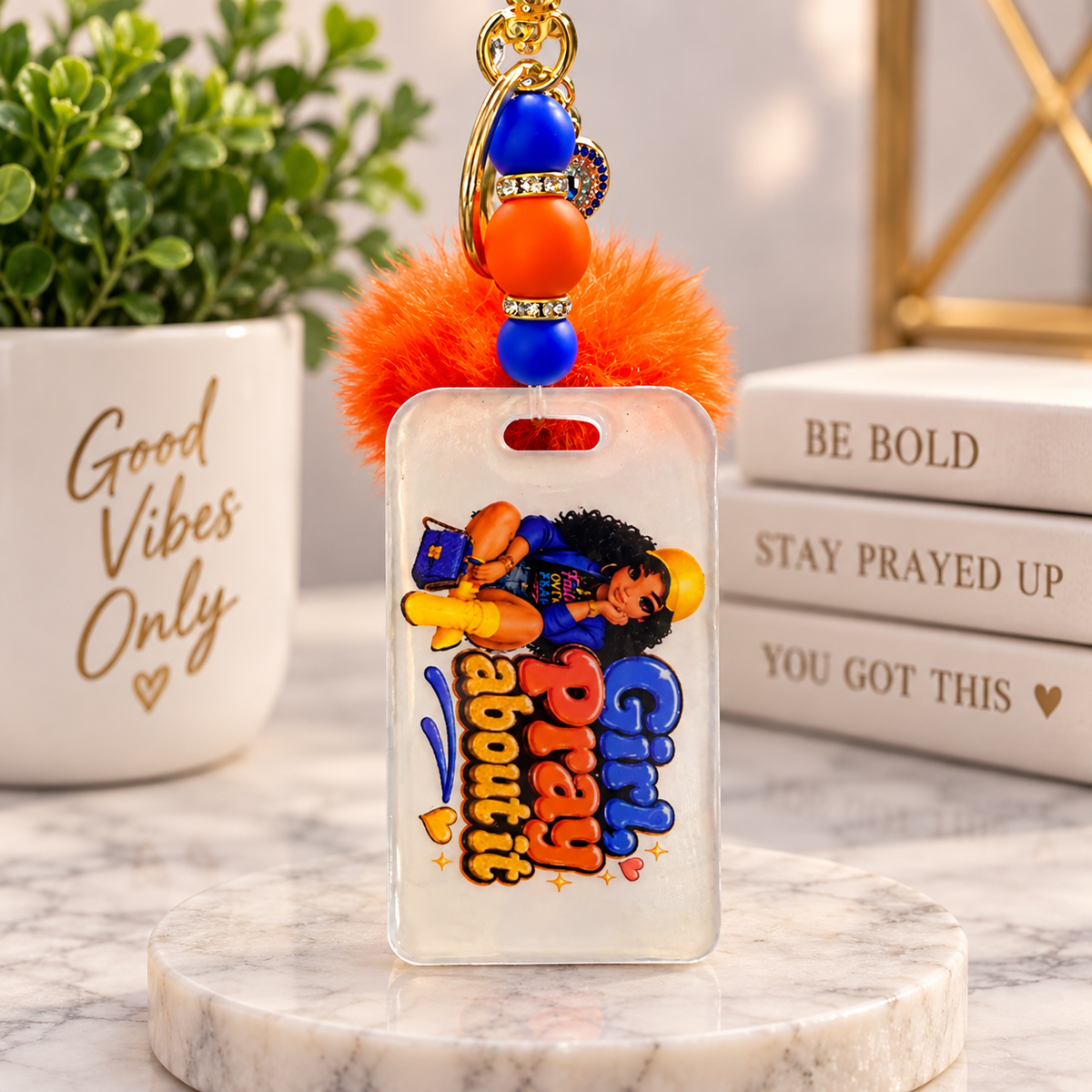Girl Pray About It beaded pom pom keychain with orange fur ball and royal blue accents