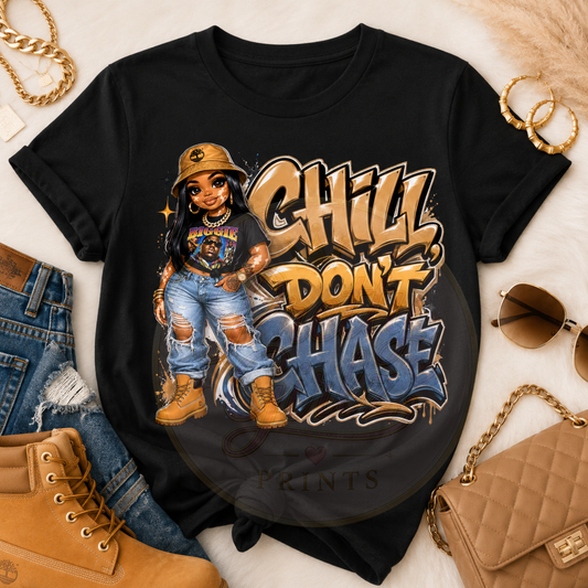 Black t-shirt with graphic design of a person wearing a hat and sunglasses, with text 'Chill Don't Chase' on a white background.