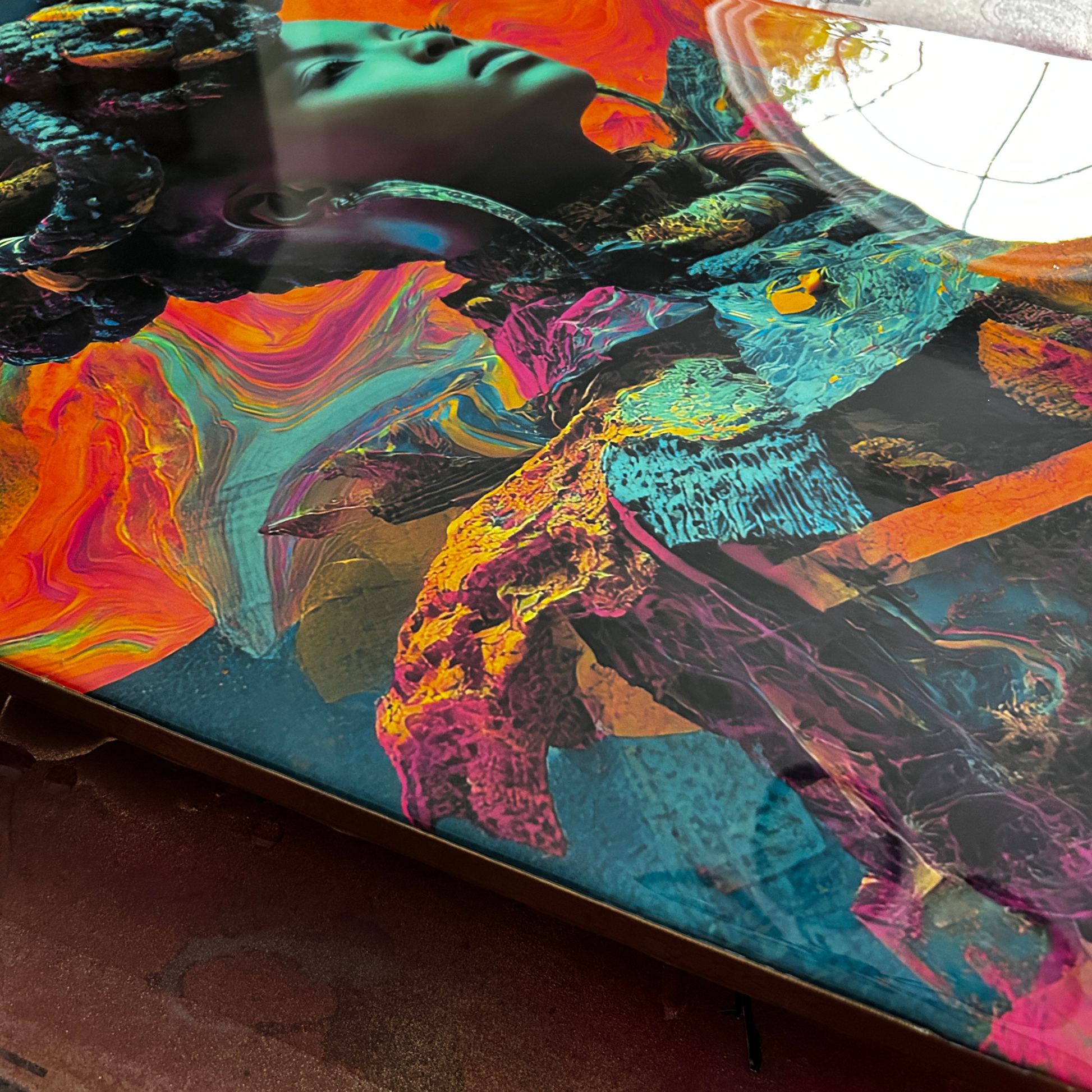 Colorful abstract art with a woman's face and flowing hair.