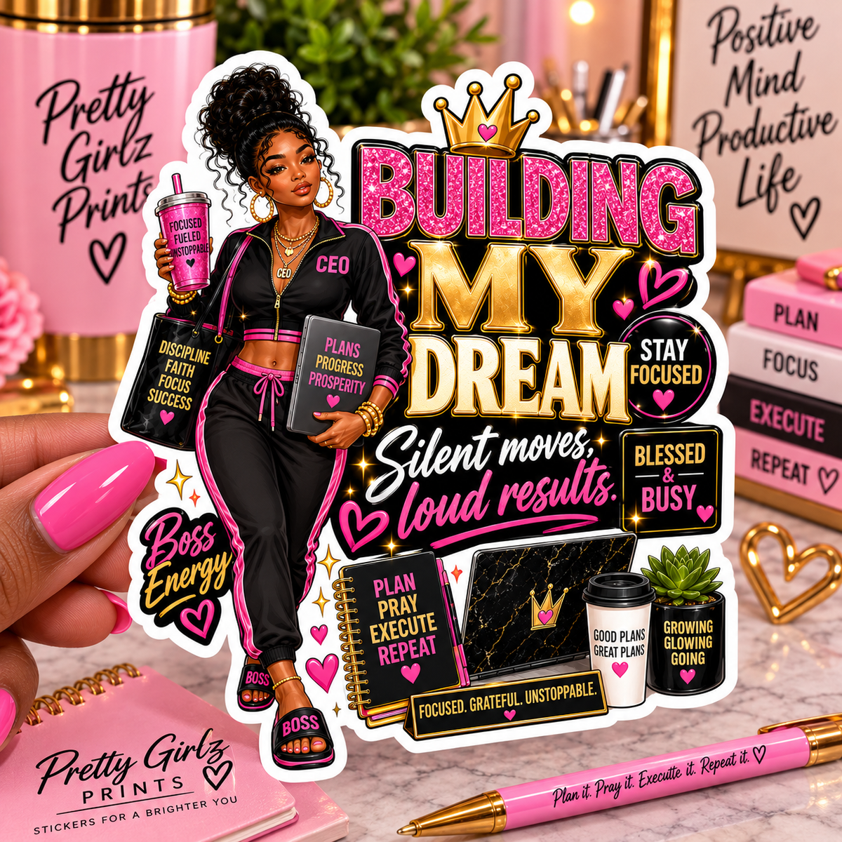 Building My Dream die-cut sticker – Black girl CEO illustration in pink tracksuit with gold crown and boss-girl affirmations, waterproof vinyl sticker