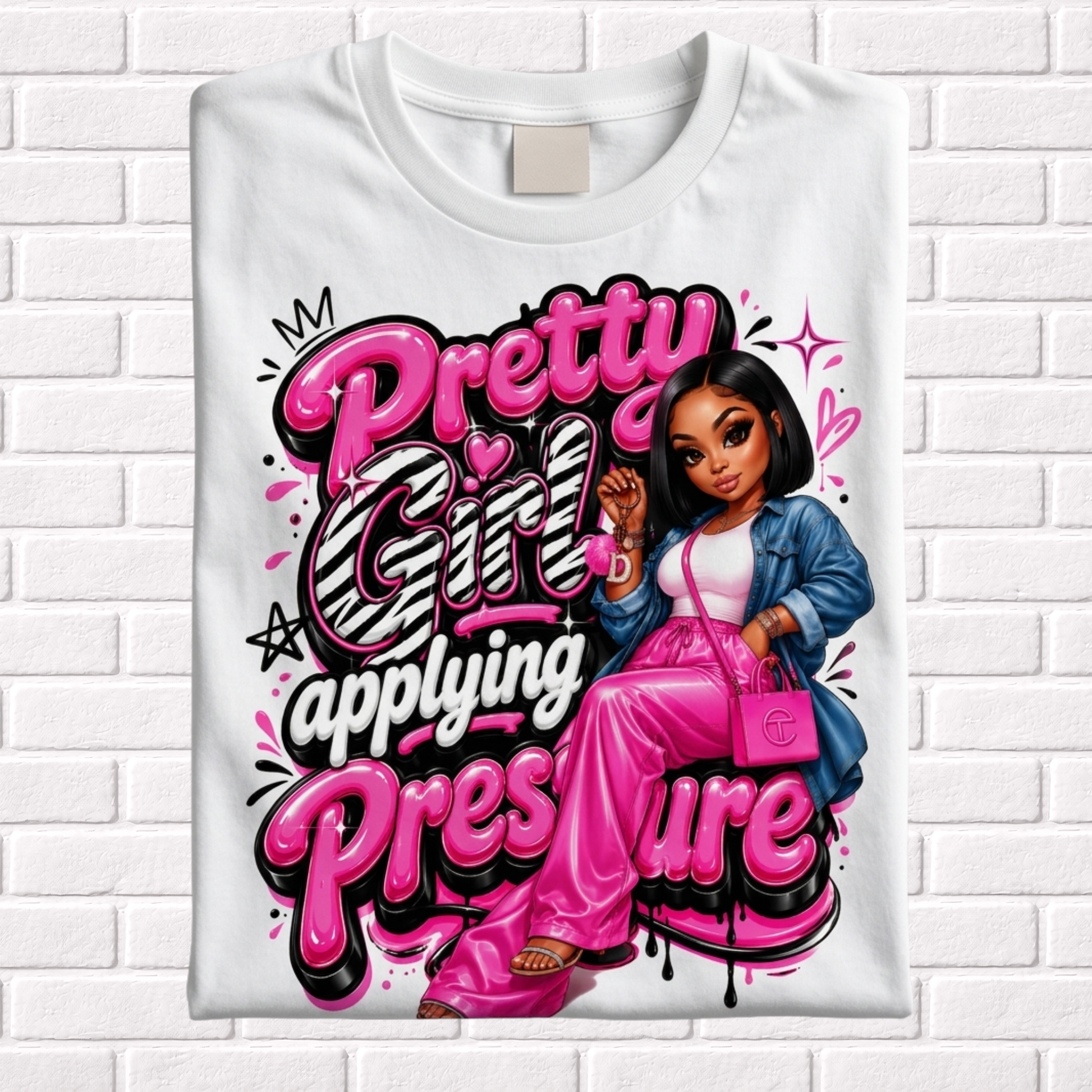 White t-shirt with a graphic design featuring a girl and text 'Pretty Girl Applying Pressure' on a white brick wall background.