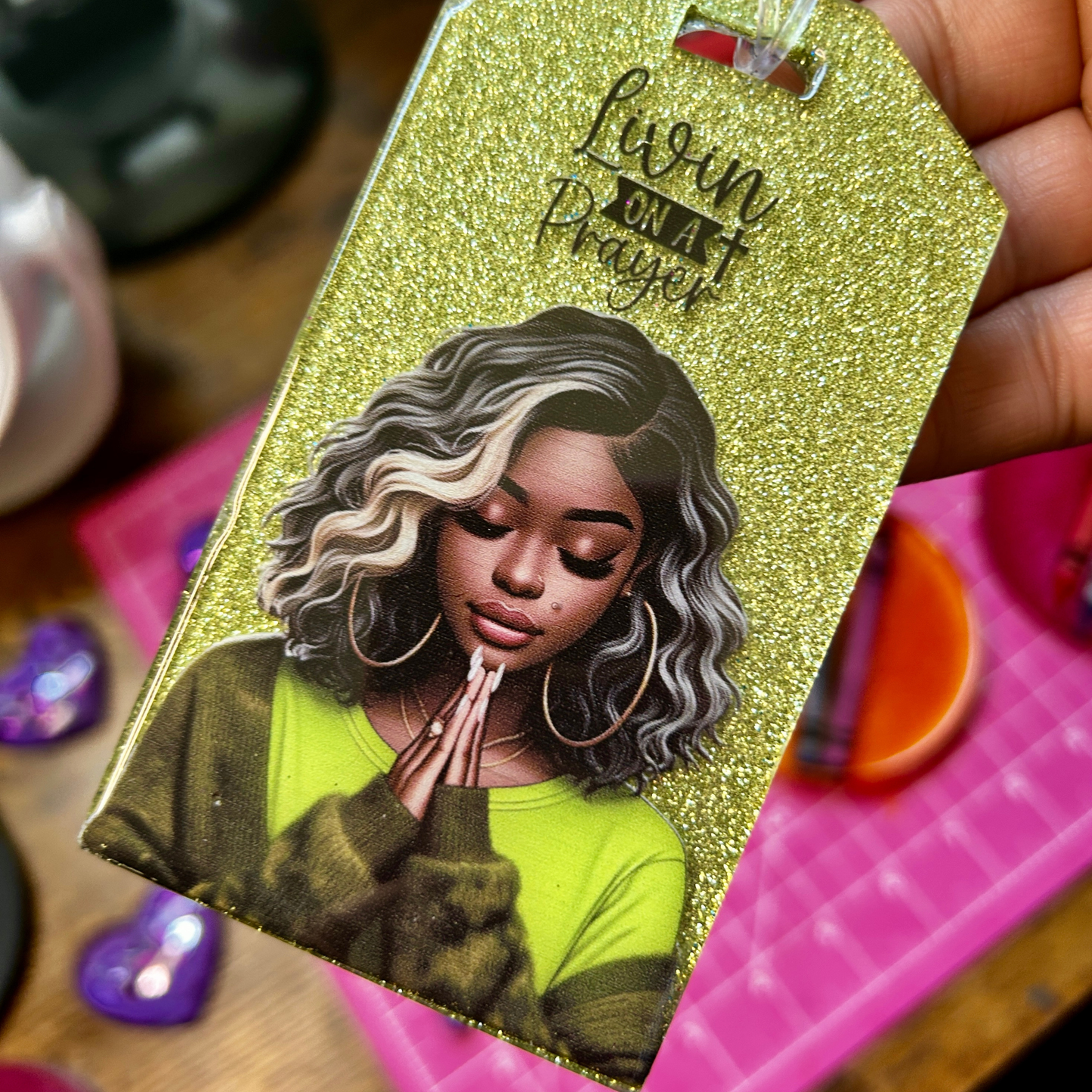 glitter handmade resin luggage tag featuring praying woman artwork and “Livin’ on a Prayer” inspirational design.