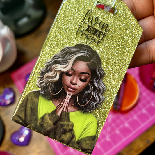 glitter handmade resin luggage tag featuring praying woman artwork and “Livin’ on a Prayer” inspirational design.